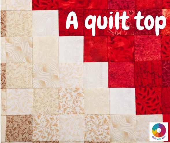 A patchwork quilt top featuring cream and red patterned fabric squares, arranged diagonally. The words A quilt top appear in bold white text, with a small colorful logo from Quilt With Kim in the bottom right corner.