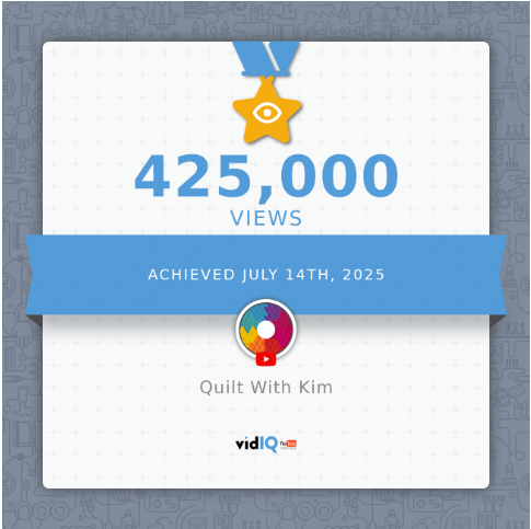 A digital certificate shows a gold star with an eye icon, 425,000 VIEWS, and “Achieved July 14th, 2025.” The channel name “Quilt With Kim” appears with the vidIQ logo below.