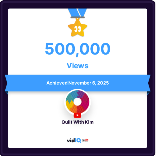 A digital certificate shows a gold star with an eye icon, 425,000 VIEWS, and “Achieved July 14th, 2025.” The channel name “Quilt With Kim” appears with the vidIQ logo below.