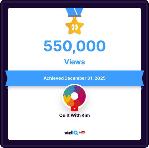 A digital certificate shows a gold star with an eye icon, 425,000 VIEWS, and “Achieved July 14th, 2025.” The channel name “Quilt With Kim” appears with the vidIQ logo below.